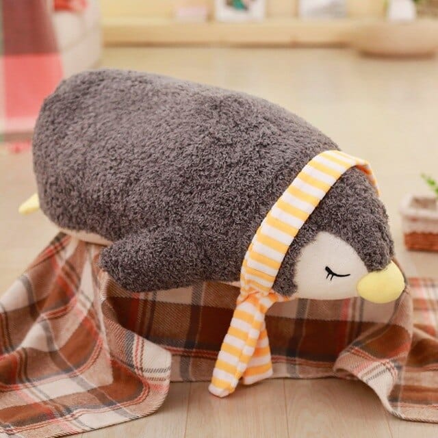 peluche-pingouin-endormie